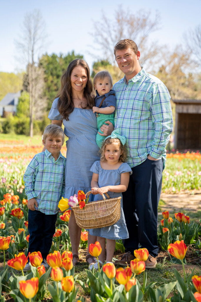 Family pictures in a field of flowers with a spring themed photoshoot