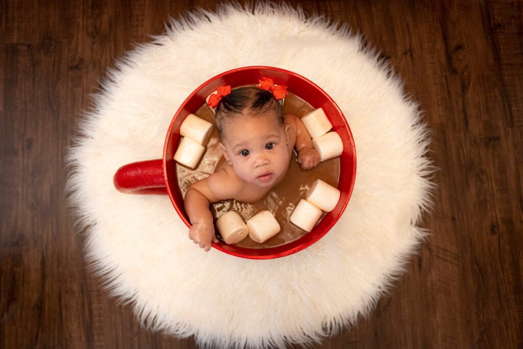 Cute and creative Christmas and Winter themed photo shoot you can do at home with a baby in a cup or mug of hot cocoa
