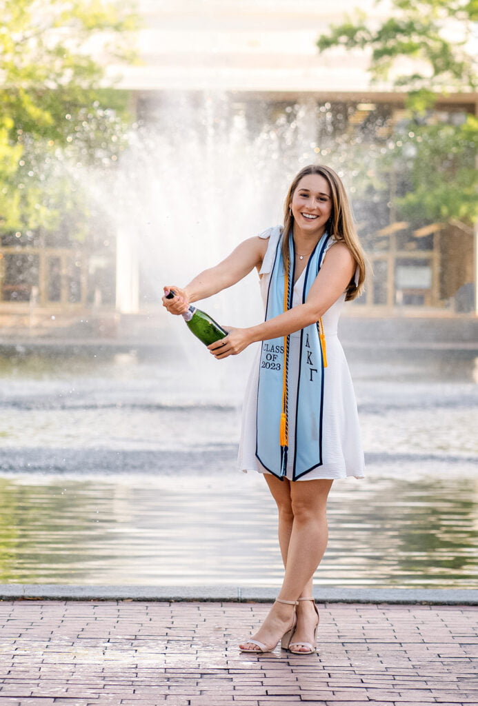 Young woman celebrating college graduation on campus at the University of South Carolina